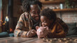 © Andres Mejia - Happy family saving money together putting coins into piggy bank