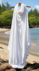 Wall Mural - a white cloth draped over a sandy beach with a white cloth draped over it.