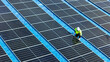 © ultramansk - Worker Technicians are working to construct solar panels system on roof. Installing solar photovoltaic panel system. Men technicians walking on roof structure to check photovoltaic solar modules.