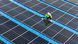 © ultramansk - Worker Technicians are working to construct solar panels system on roof. Installing solar photovoltaic panel system. Men technicians walking on roof structure to check photovoltaic solar modules.