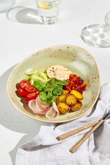 Wall Mural - Fresh Vegetable Salad Bowl with Roasted Potatoes and Ranch Dressing