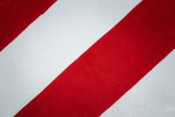 Wall Mural - A red and white striped surface with a red stripe on the left and a white stripe on the right