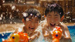 © bephoto - 屋外プールで水鉄砲を使う日本の男の子たち