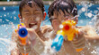 © bephoto - 屋外プールで水鉄砲を使う日本の男の子たち