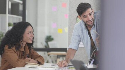 A team of analysts and developers is discussing computer and phone programs for applications and artificial intelligence. Showcasing ideas from an international team in a modern conference room.