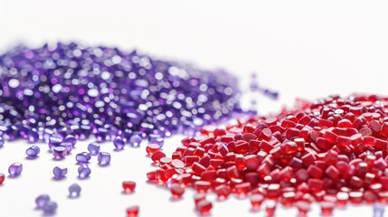 Red and purple plastic pellets on white background for creating company banners