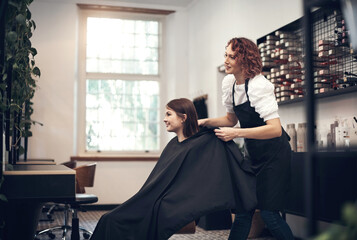 Wall Mural - Woman, hairdresser and business or salon preparation, professional stylist and client in chair. Discussion, treatment and conversation for haircut style, customer and beauty industry for service