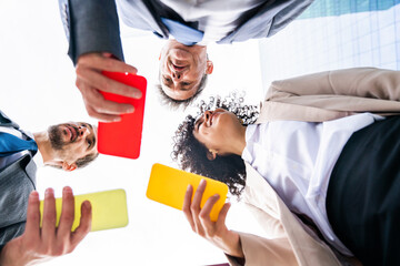 Wall Mural - Multiracial group of business people bonding outdoors - International business corporate team wearing elegant suit meeting in a business park