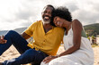 © oneinchpunch - Beautiful mature senior black couple of lovers dating at the seaside - Married african middle-aged couple bonding and having fun outdoors, concepts about relationship, lifestyle and quality of life