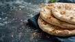 © AImmersive Imagery - Close up of pita bread on a dark background with space for text