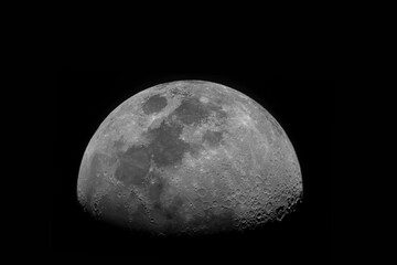 Wall Mural - crescent moon with moon craters on a dark space background