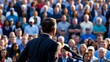 © Arceli - High-resolution photograph featuring a man with short, dark hair, seen from behind, standing in front of a large img
