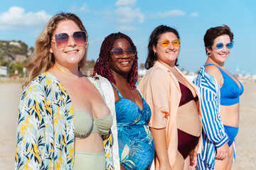 Wall Mural - Group of beautiful plus size women with swimwear bonding and having fun at the beach - Group of curvy female friends enjoying summertime at the sea, concepts about body acceptance, body positive