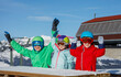 © Sergey Novikov - Colorful group of kids at the snowy mountainside picnic table