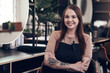 © CanBorg/peopleimages.com - Portrait, woman and hairdresser in salon, arms crossed and small business for haircare, employee and apron. Startup, service and person with tools for working, entrepreneur and pride for barber shop