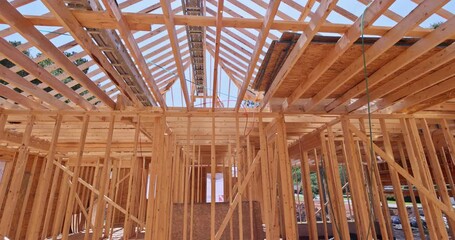 Wall Mural - Roof of new timber truss framed home is in process of being installed