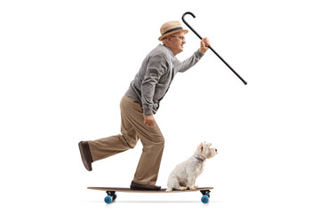 Wall Mural - Full length profile shot of a senior man with a dog riding a longboard