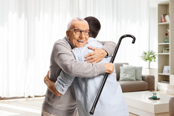 Wall Mural - Elderly and young man in embrace