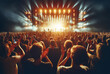 © Lucian - concert, music festival, people with the back clapping their hands above the head, lit stage, view from the back