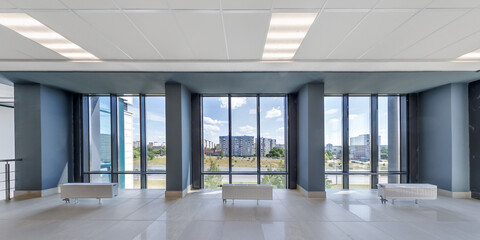 Sticker - panorama view in empty modern hall with columns, doors and panoramic windows.