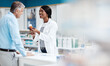 © ReeseArcurs/peopleimages.com - Pills, helping and pharmacist with man by dispensary for prescription medication for treatment. Discussion, medicine and female healthcare worker with mature patient for tablets in drugstore chemist.