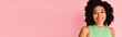 © LIGHTFIELD STUDIOS - A woman with curly hair stands confidently against a vibrant pink background.