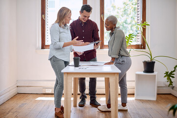 Canvas Print - Discussion, meeting and business people in office with paperwork for collaboration, communication or planning project. Table, diversity and staff for tablet, review or teamwork at magazine company