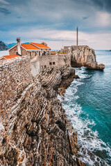 Wall Mural - Stunning coastal landscape in Petrovac, Montenegro, showcasing the old castle and rocky shoreline