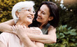 © ReeseArcurs/peopleimages.com - Nature, senior mom and woman with hug for love, vacation and bonding together in garden. Happy people, mother and daughter with embrace in park, care and healthy relationship with smile outdoor