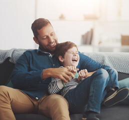 Sticker - Tickle, laughing and dad with child on sofa for bonding, happy relationship and relax in living room. Family, lovel and father and young boy having fun for joke, playing and cuddle on couch in home