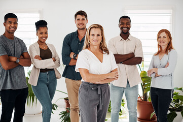 Wall Mural - Business team, portrait and arms crossed in office with leadership, company pride and happy group for startup. Design staff, collaboration and employees with diversity, creative agency and solidarity