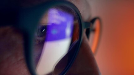 Adult Man Eyes in Glasses Looking at PC Screen and Working on Computer Program Close Up. Eyeballs in AR Eyewear of Person Networking Online at Night. Employee Reading Social Media or News at Internet