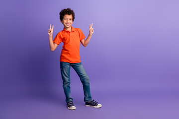 Sticker - Full length photo of funky cool son dressed orange t-shirt showing two v-signs emtpy space isolated violet color background