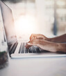 © peopleimages.com - Hands, typing and laptop browsing in office, person and writing email or corporate business on technology. Online, research and planning project for digital information, company website and working