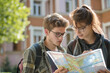 © Roza - Students with backpacks looking for their building on a campus map