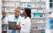 © ReeseArcurs/peopleimages.com - Medical, people and conversation with checklist in pharmacy for dispensary, inspection or advice. Healthcare, intern and pharmaceutical student with mentor by pills for inventory, supply and training