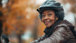 © Natalia Schuchardt - Joyful Senior Black Woman Cycling: Active Lifestyle in the Park Reflecting Happiness and Health in Elderly Community