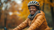 © Natalia Schuchardt - Joyful Senior Black Woman Cycling: Active Lifestyle in the Park Reflecting Happiness and Health in Elderly Community