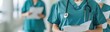 © Wasana - Healthcare workers reviewing patient charts, treatment planning, medical support resources