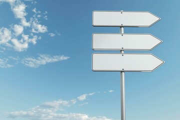 Wall Mural - The image shows three empty white road signs with arrows on a pole against a clear blue sky with some clouds.