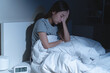 © Pormezz - Anxiety disorder on insomnia woman concept, sleepless Woman open eye awakening on the bed at night time can't sleep from symptom of depression diseased.