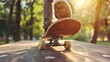 © PAPAGAP - Close-up of a skateboarder's foot on a skateboard, riding on a wooden surface with a sunlit park background.