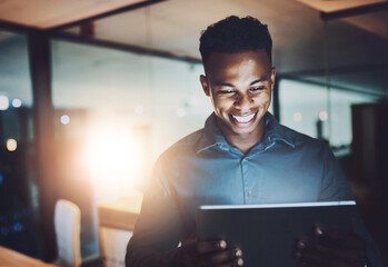 Canvas Print - Office, tablet and business black man at night online for website, research and internet for project deadline. Corporate, working late and worker on digital tech for stock market, planning or fintech