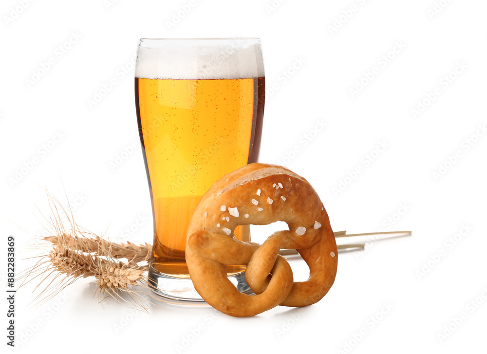 Soft pretzel and glass of beer on white background