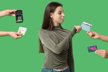 Wall Mural - Young woman and hands with payment terminal, cash, credit card and holder on green background