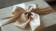 © UnderTheSun - Elegant gift box with a cream satin ribbon bow. Perfect for special occasions, celebrations, and gift wrapping inspiration.