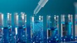 © Humeyra - Laboratory glassware concept with test tubes containing blue liquid water samples and a pipette showcasing a pipette dropping a sample into a test tube against a blue background