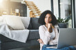 © JorSons/peopleimages.com - Thinking, laptop and woman with credit card in living room for subscription, payment or online shopping on floor. Decision, thoughtful and person for ideas, streaming service or investment in home