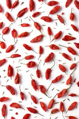 Wall Mural - A close-up shot of multiple red chili peppers arranged on a white surface, great for food or cooking-related uses