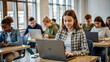 © NewFresh  - education, high school, technology and people concept - group of smiling students with laptop computers in classroom